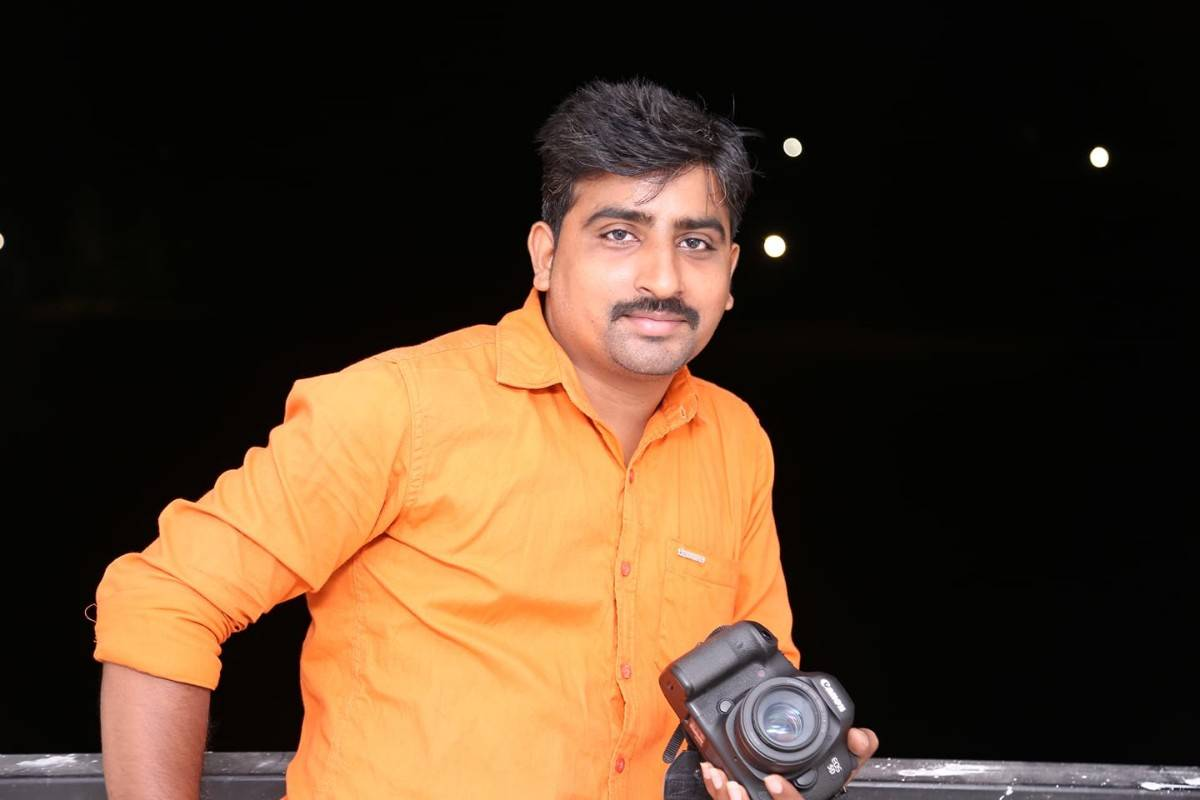 Ram - Professional Photographer with Canon Camera